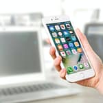 holding a mobile phone